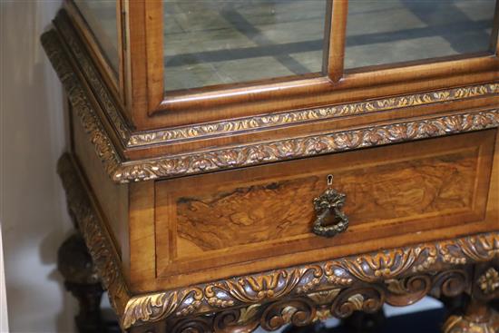 A 1930s Queen Anne revival walnut display cabinet, W.4ft 10in. D.1ft 4in. H.4ft 10.5in.